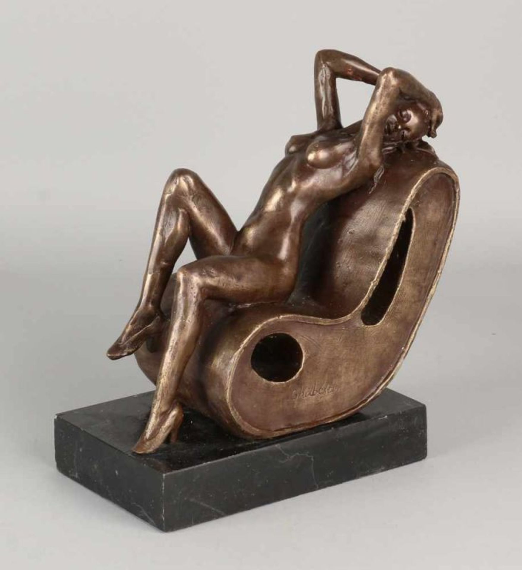 Bronze Fig. Naked lady designer chair. On black marble base. 21st century. Size: 20 x 20 x 10 cm. In