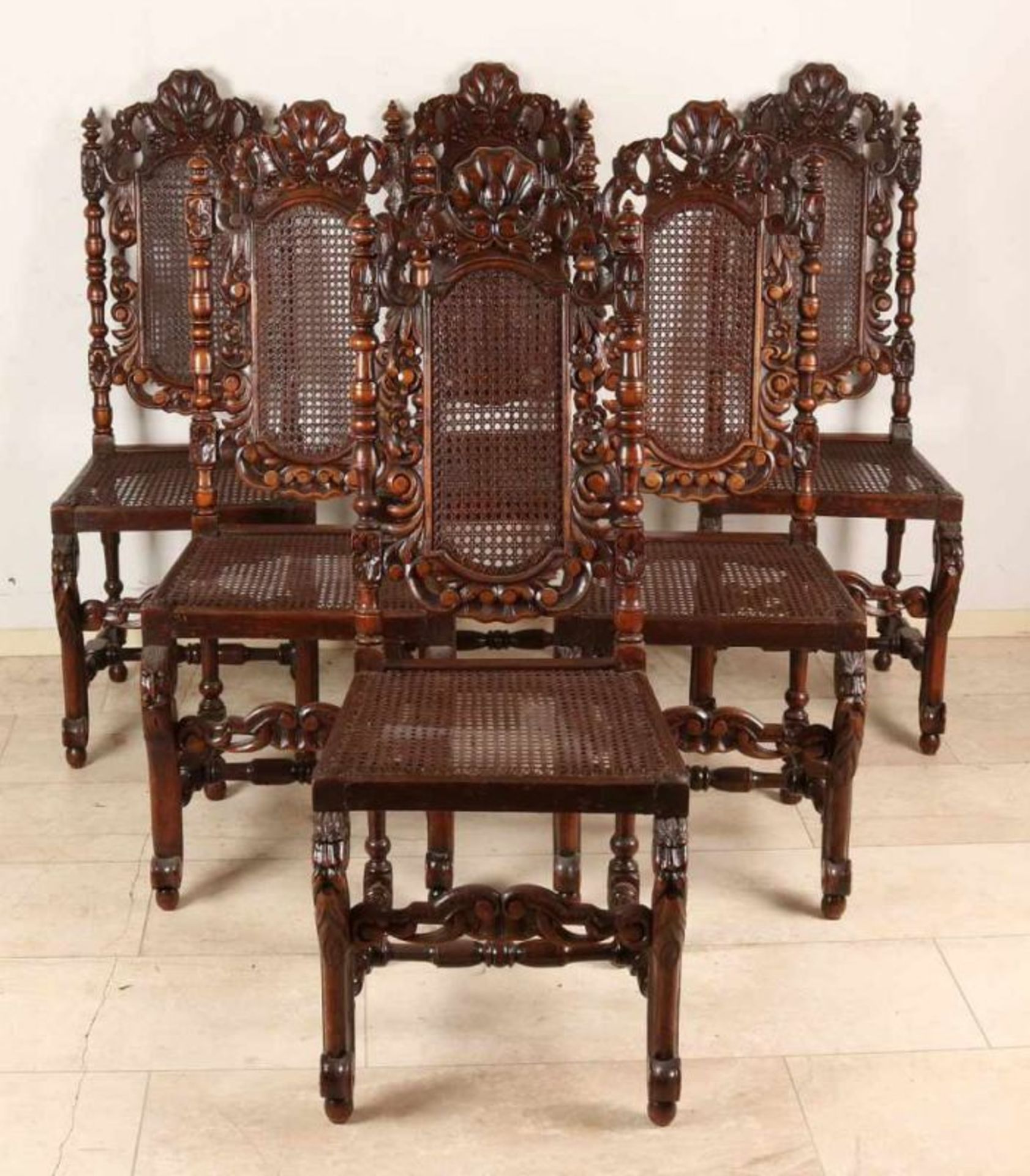 Six antique French oak Neo Renaissance stabbed chairs with wicker. Fratsen tendrils and on the legs.