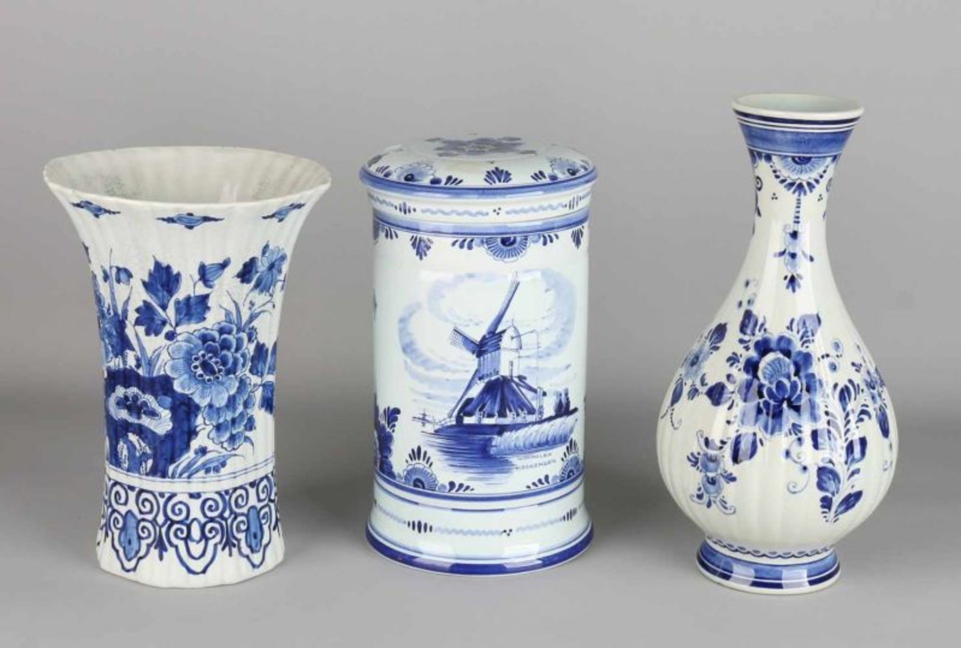 Three times Delftware. Circa 1930 - 1950. Comprising: Porcelain bottle vase, trumpet-shaped.