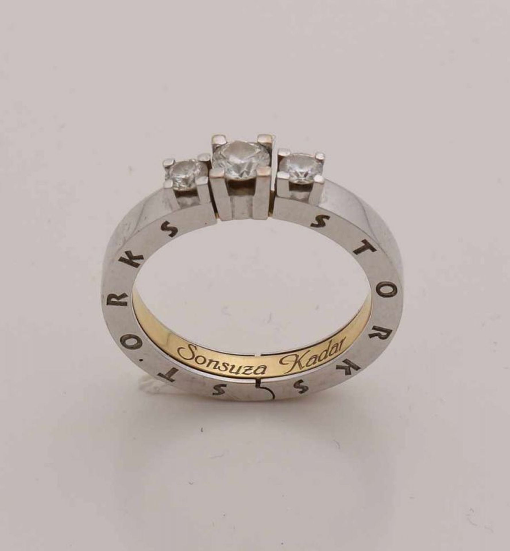 Special gold ring, 750/000, with diamonds. White gold broad tightly articulated outer ring-shaped,