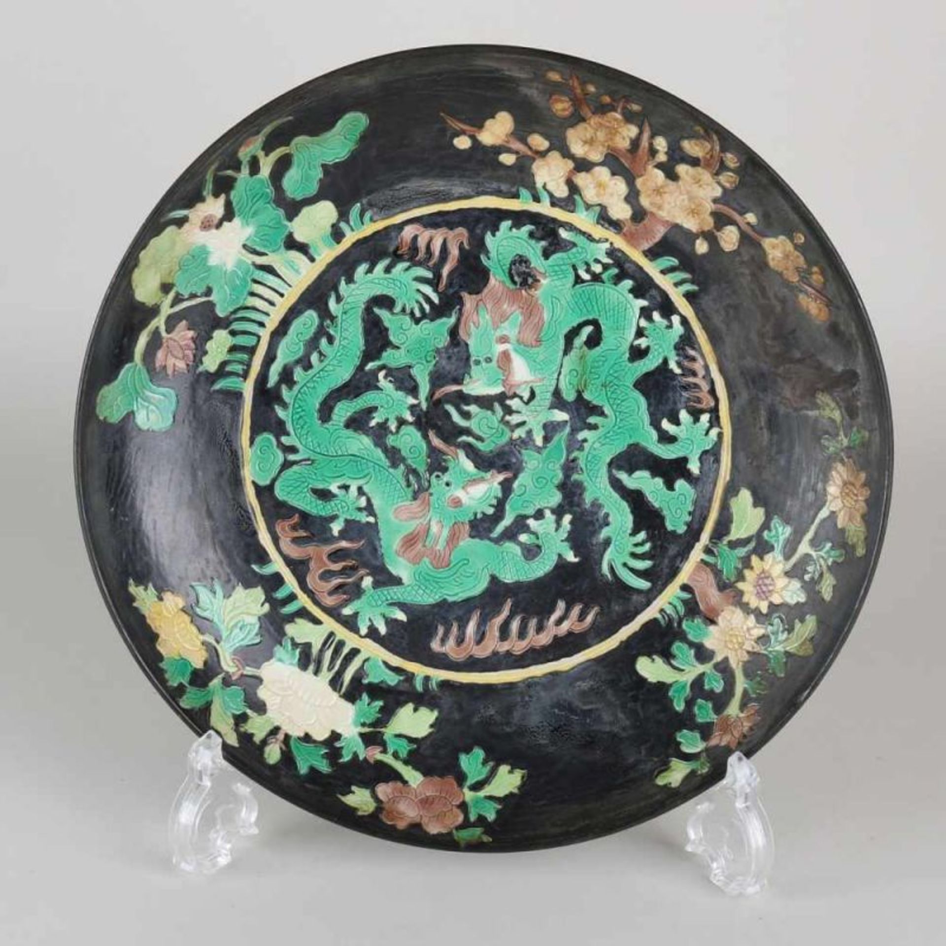 Chinese porcelain Kangxi labeled ornamental dish with floral decoration and dragons. 20th century.