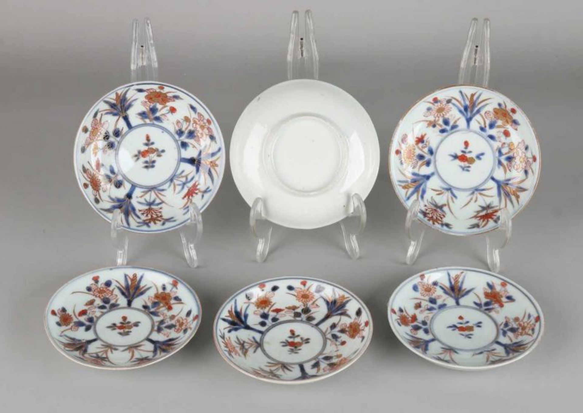 Six 18th century Chinese porcelain cups and saucers with floral decor. Four cups of good, two