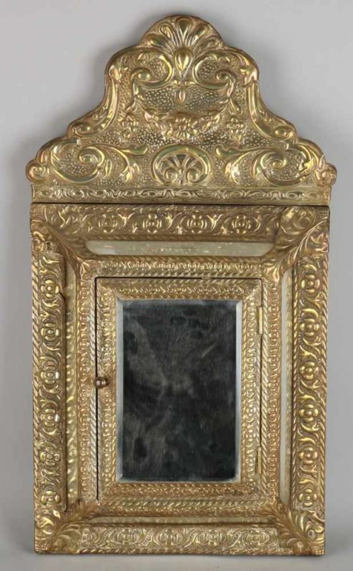 Antique brass brush with beaten mirror cabinet and two beaten brass brushes. Circa 1900. Size: 63