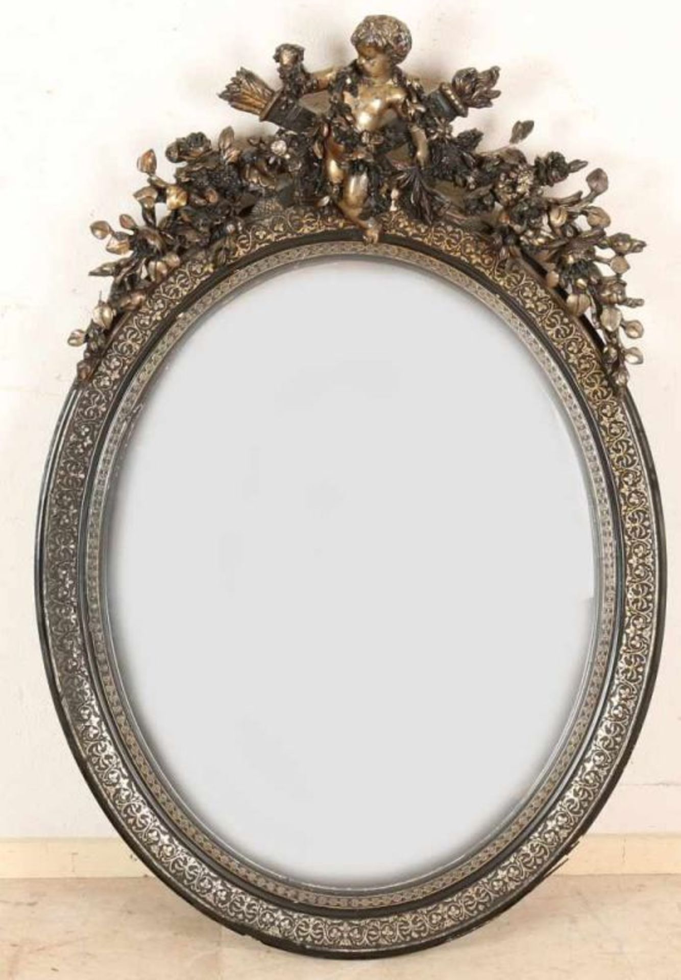 19th Century French stucco mirror with putti, festoons and double-faceted mirror. Circa 1870.