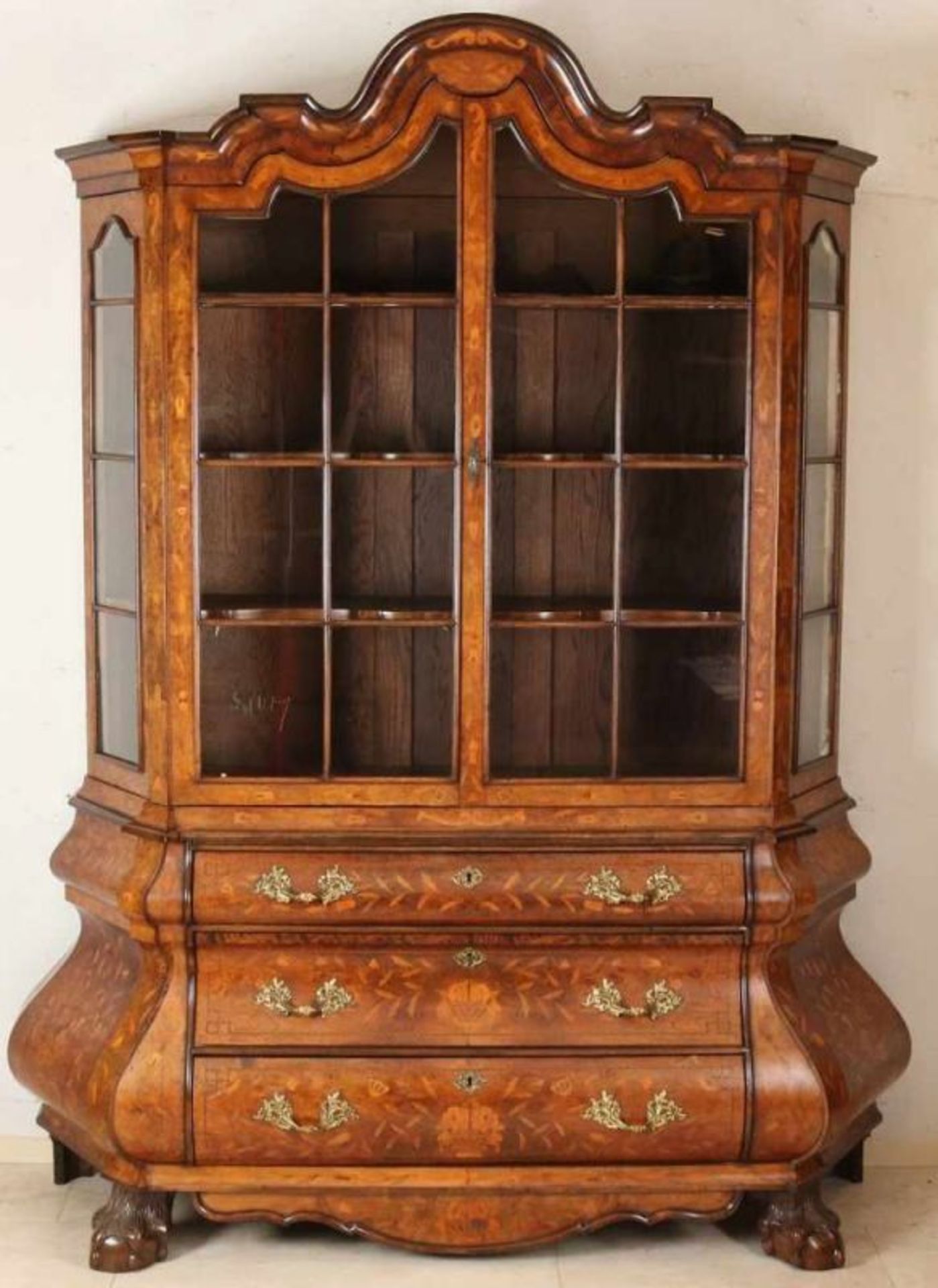 19th Century Baroque walnut cabinet with rich floral marquetry, bronze fittings and claw feet.