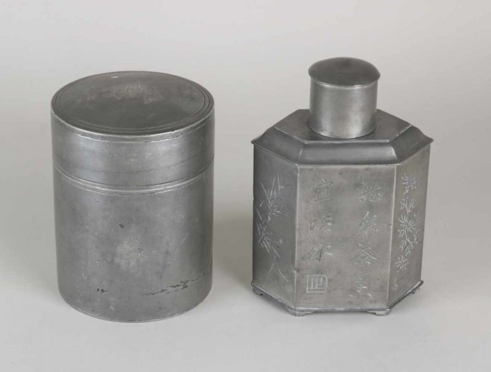 Two antique pewter tea caddies with Chinese characters. First half 20th century. Size 14.5 - 16
