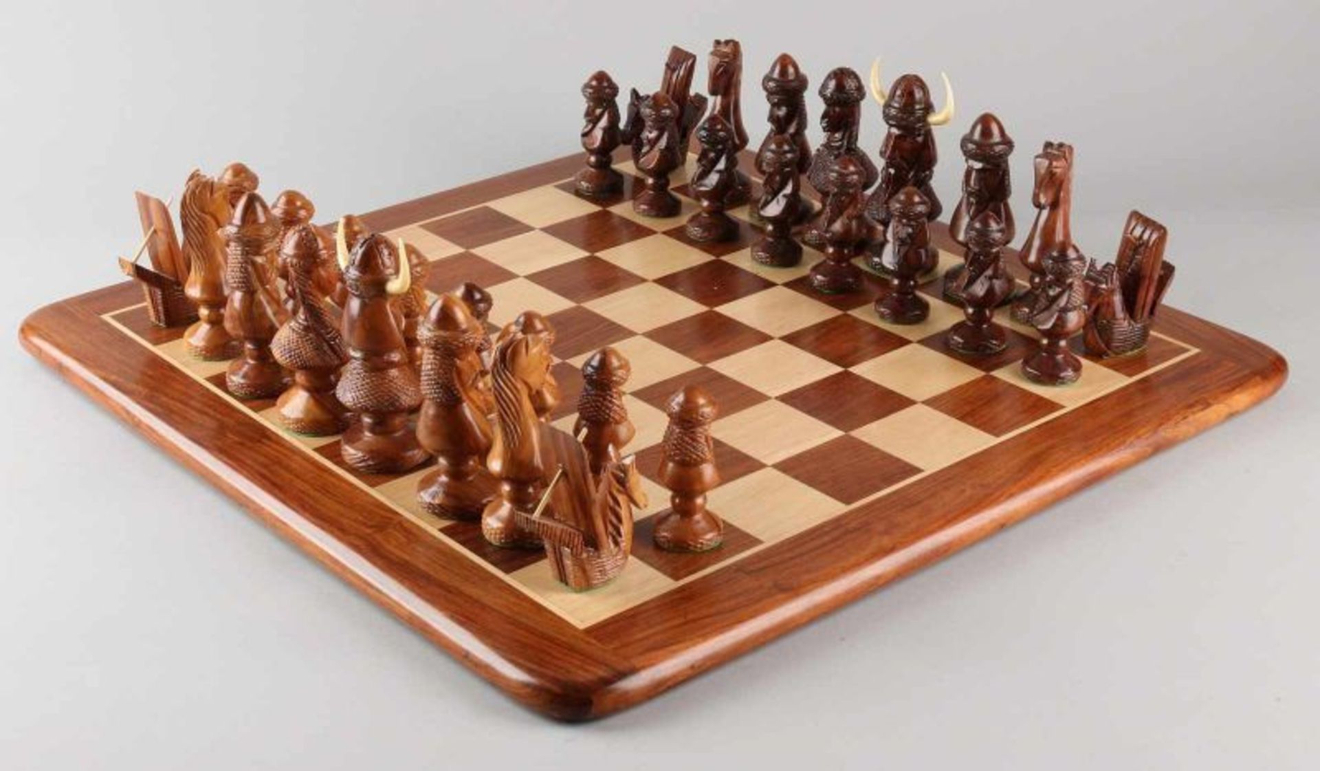 Two carved chess sets. One time set Normans + wooden chessboard. One time set Africa, Madagascar + - Image 2 of 5