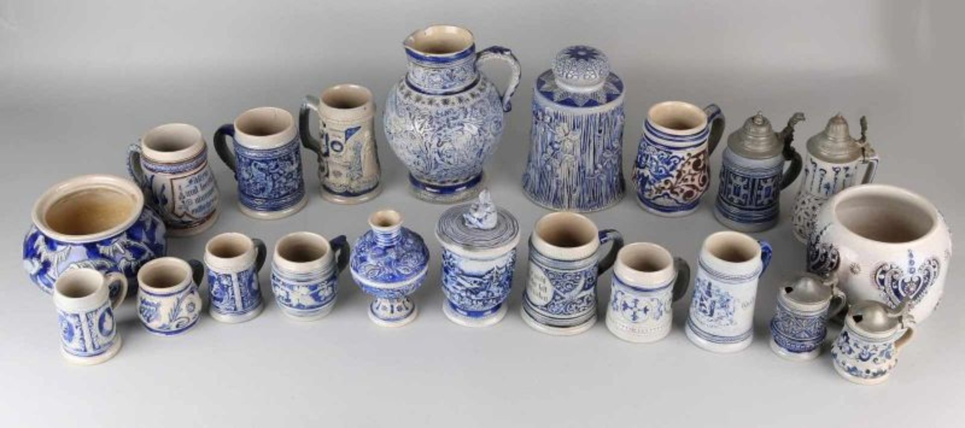 Twenty German antique pieces. Divers stoneware, ceramics, gray / blue glaze. Some damage possible.