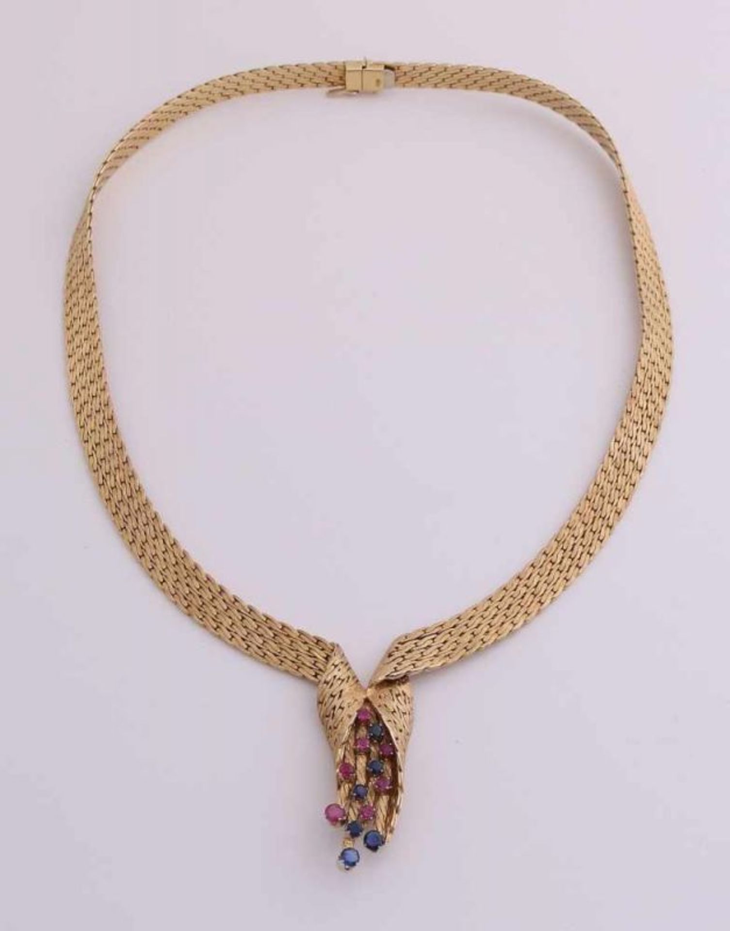 Yellow gold choker, 750/000, with ruby ??and sapphire. Extending choker, 7-9mm, with in the middle a