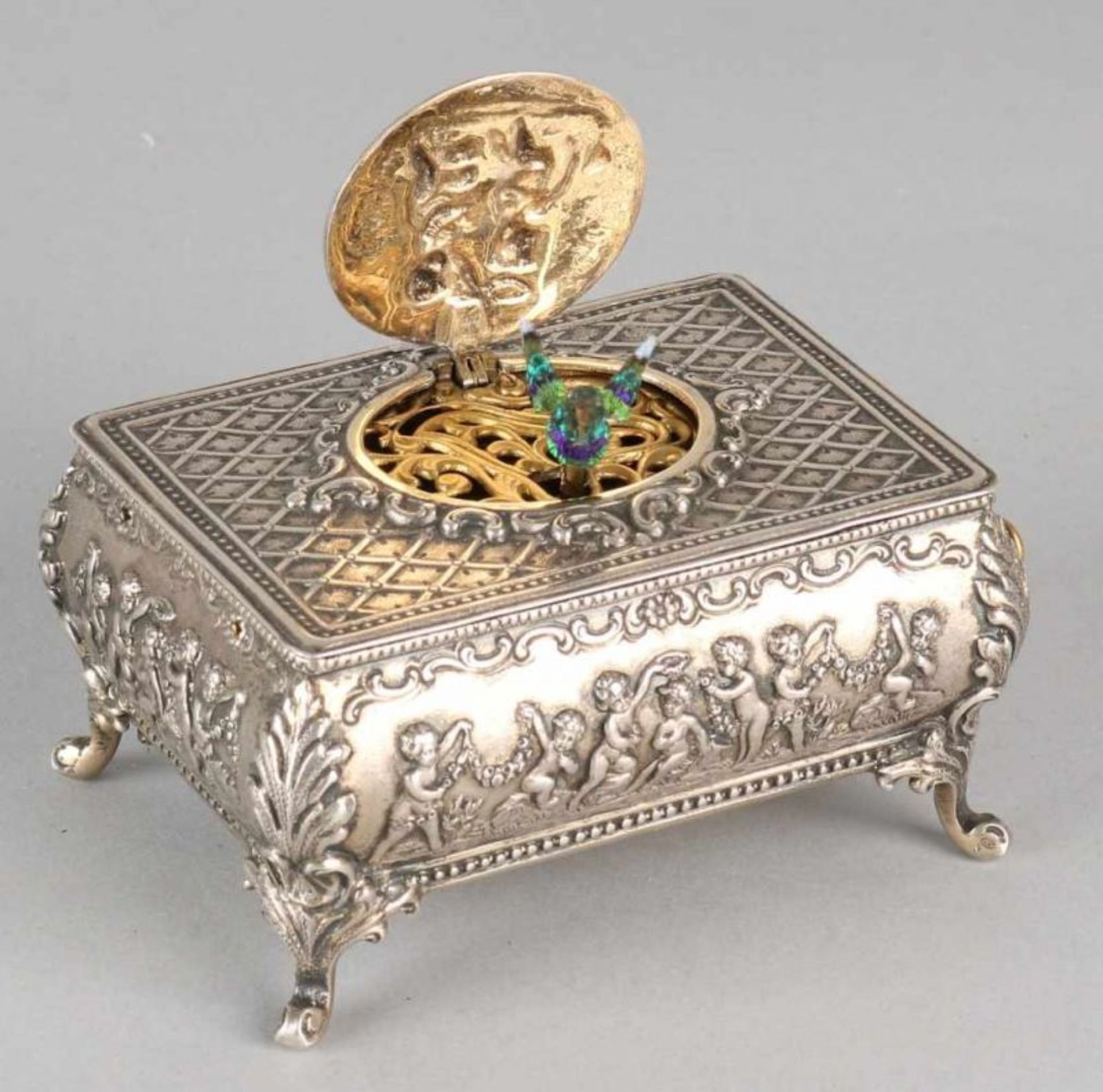 Fine silver music box, 835/000, Griesbaum, rectangular grid model decorated with decor and putti,