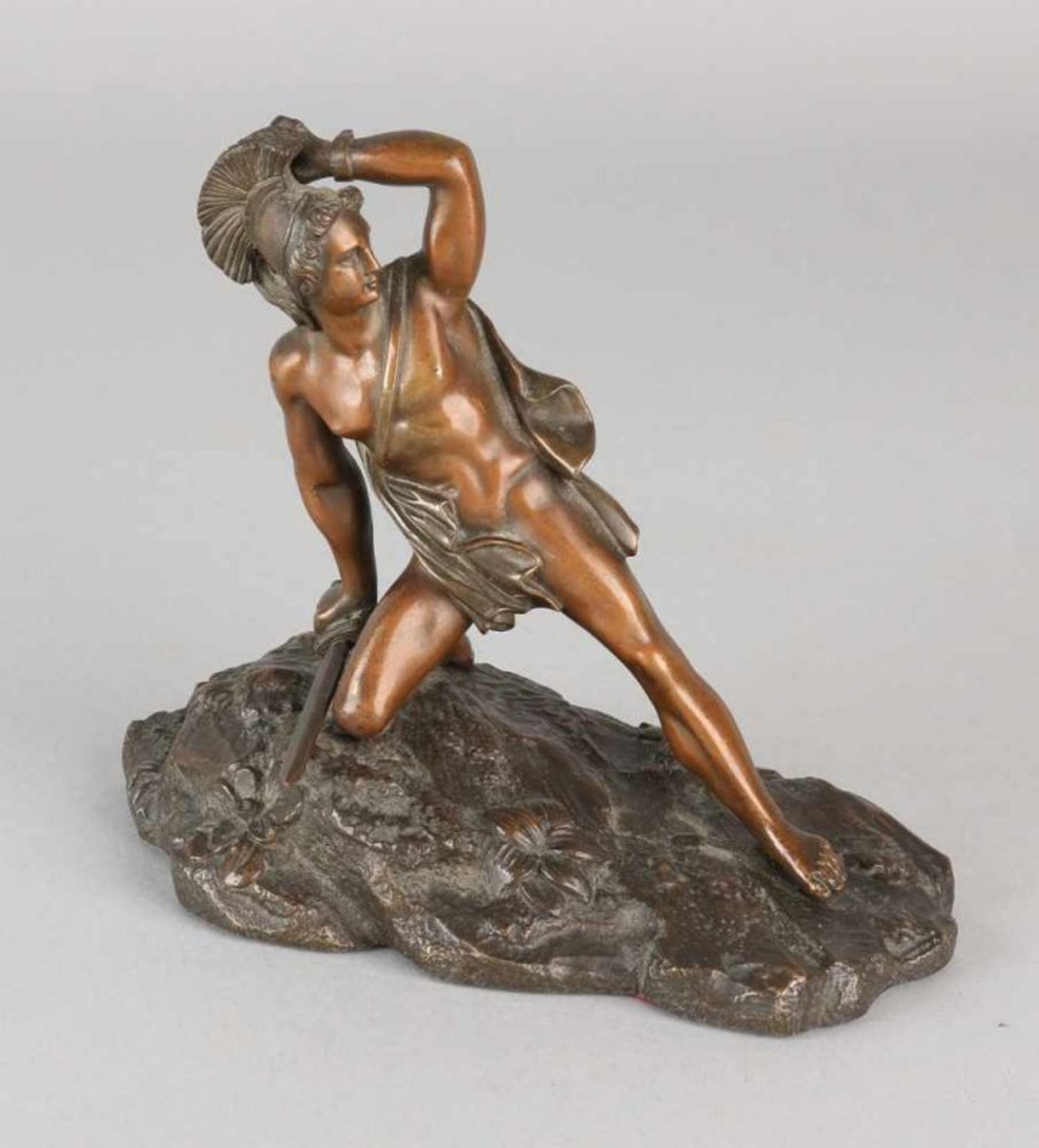 Antique bronze figure. 19th century. With Roman short sword. Size: 11 x 14 x 8 cm. In good