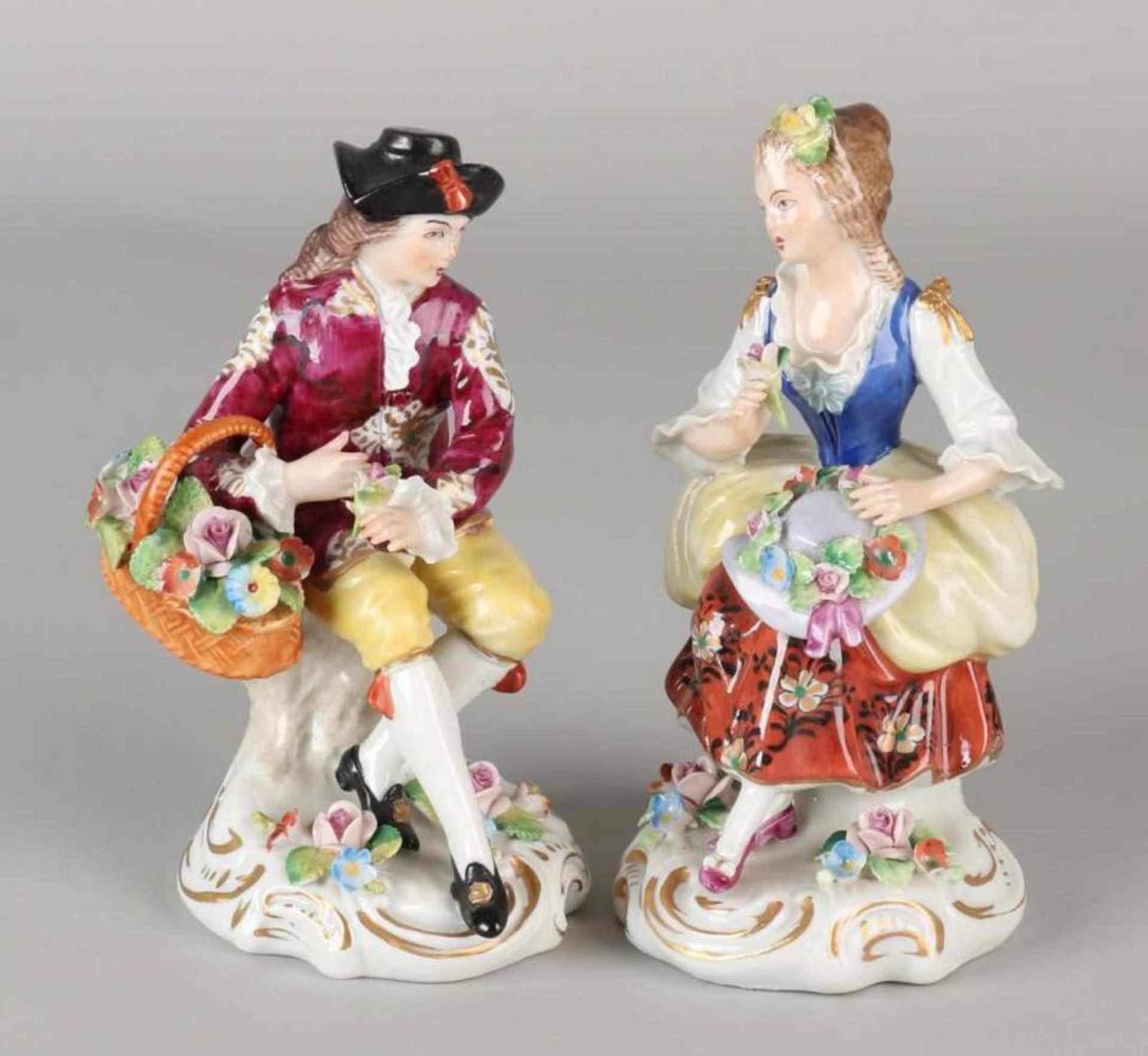 Two old German Sitzendorf porcelain figures. Man and woman with flowers. Minimum chip. 20th century.