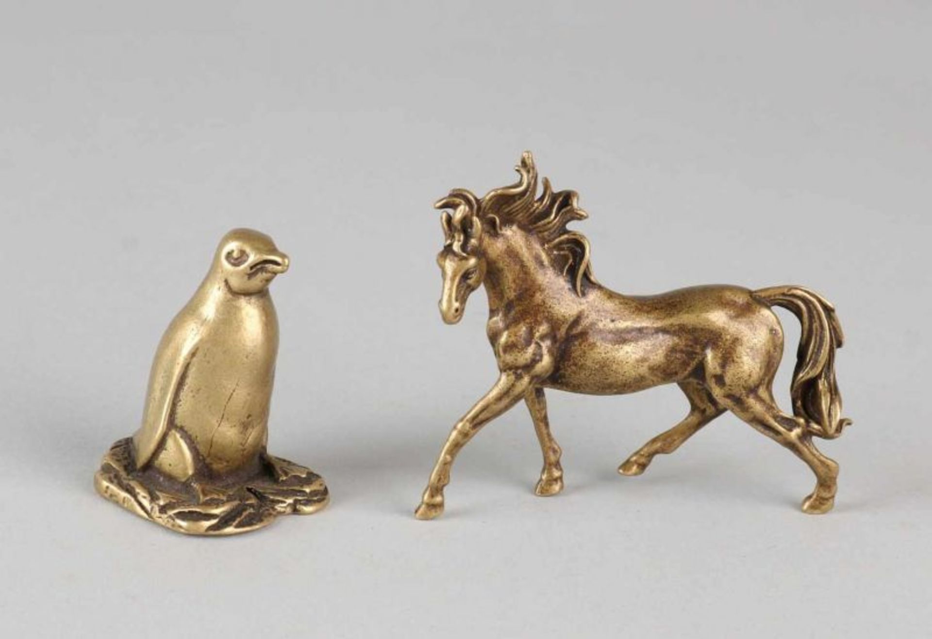Two small old / antique bronzes. 20th century. Penguin + horse. Size: 4-7 cm. In good condition.