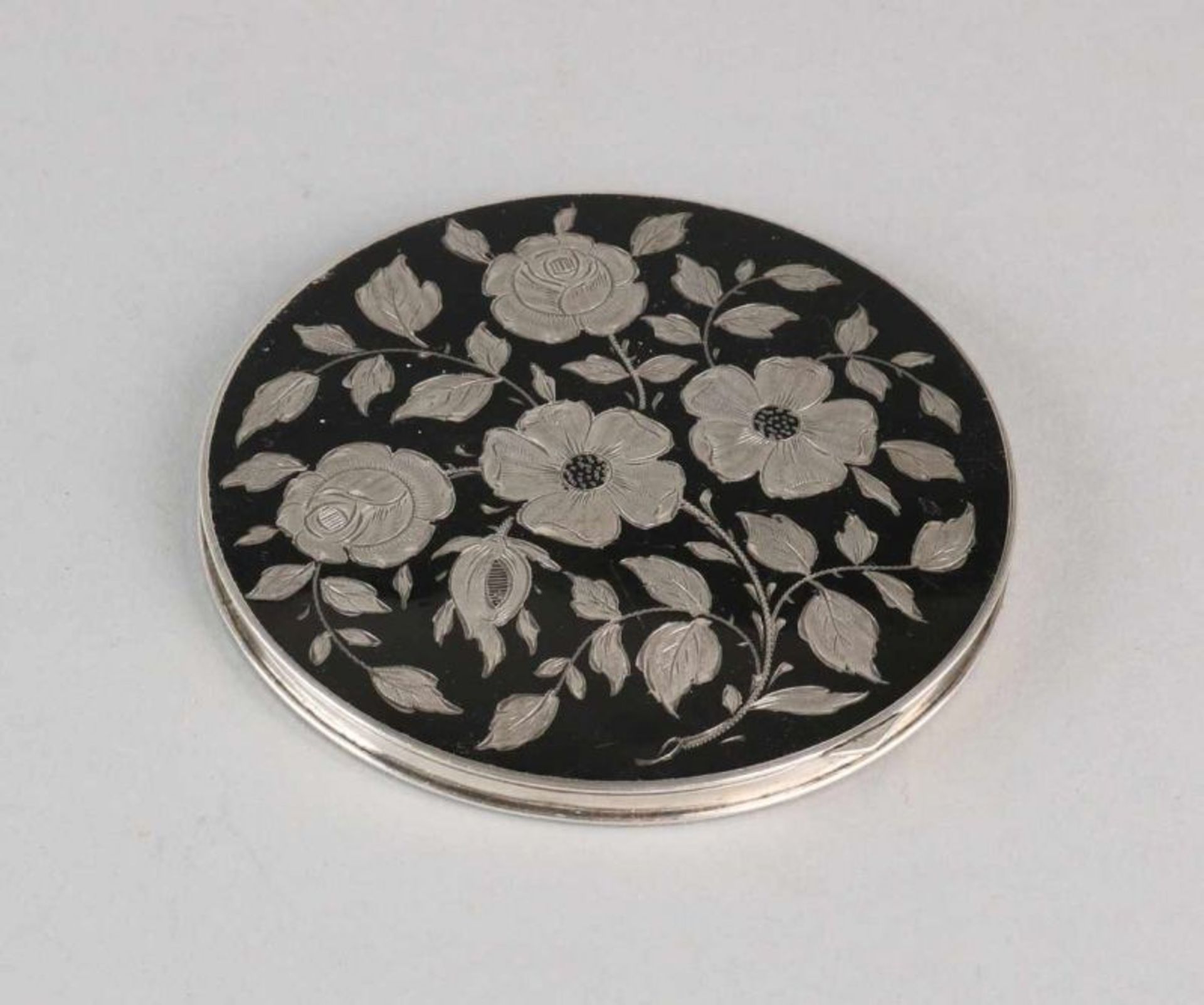 835/000 black enamelled silver powder box with beautiful floral lid inside with faceted mirror.