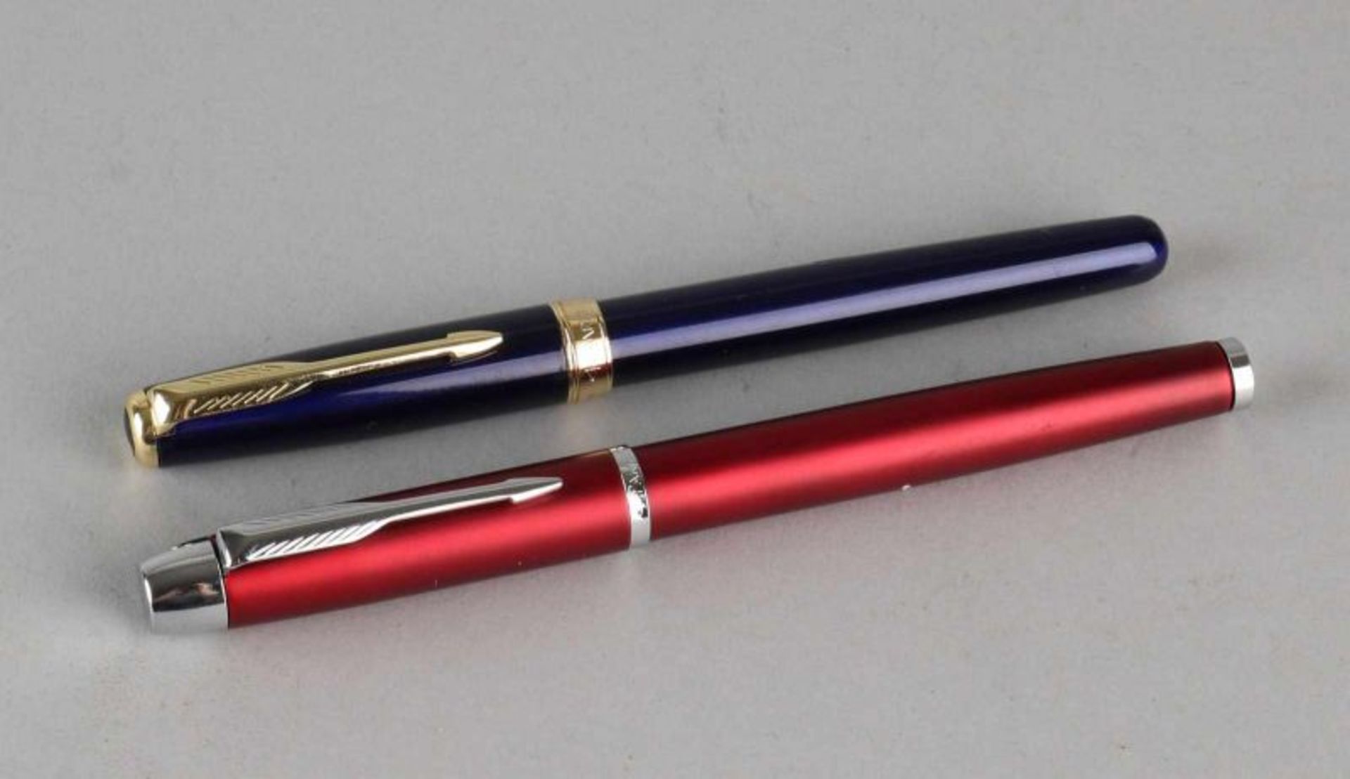 Two Parker pens, red, model I.M. and a blue Sonnet model with double accents. 14 cm. New