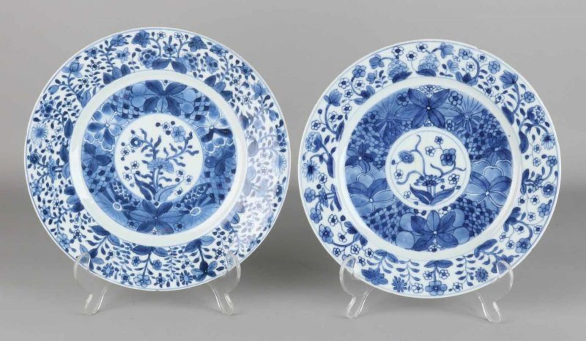 Two 17th - 18th century Chinese porcelain Kangxi dishes with floral decor and bottom mark. One