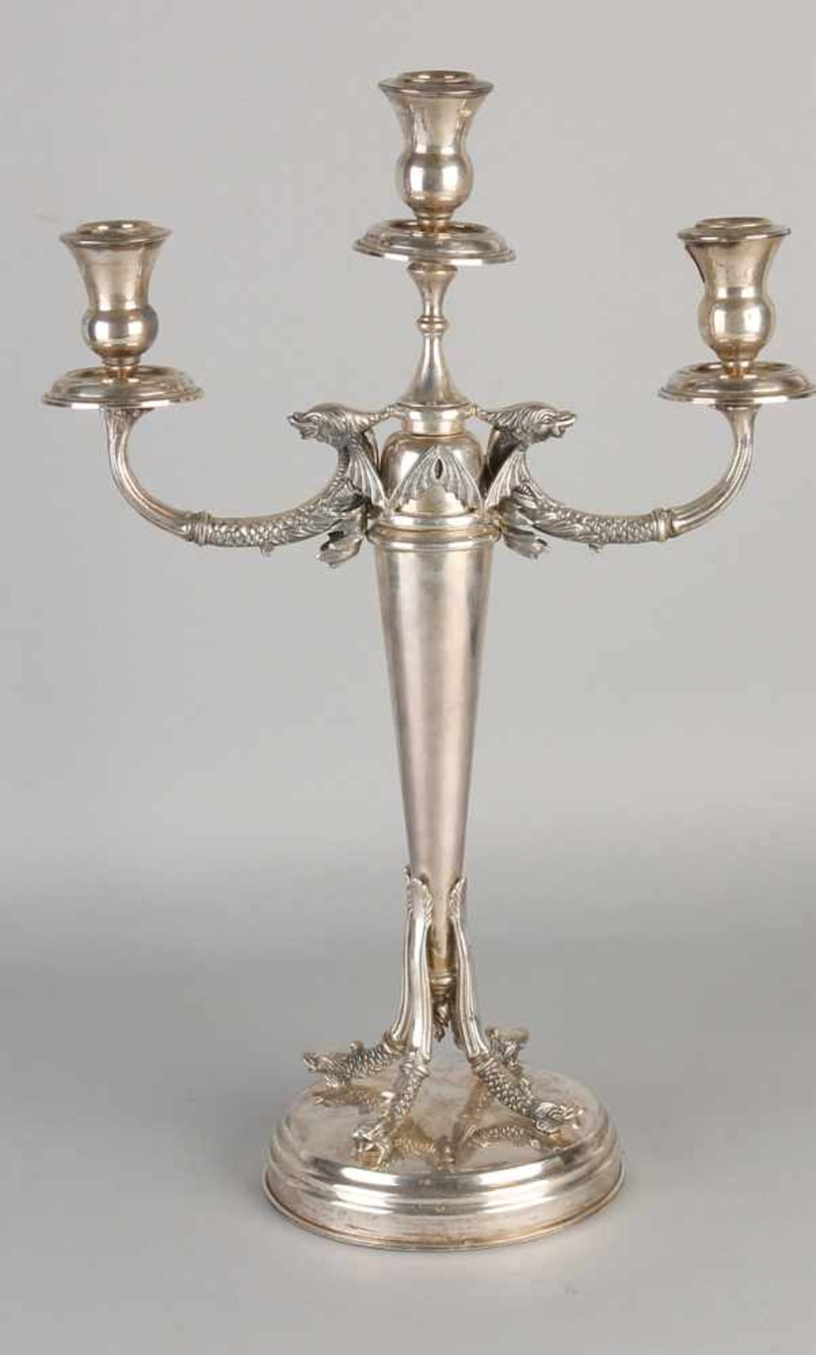 Imposing silver candlestick, 900/000, 3 light, with two arms in the form of winged dolphins. The