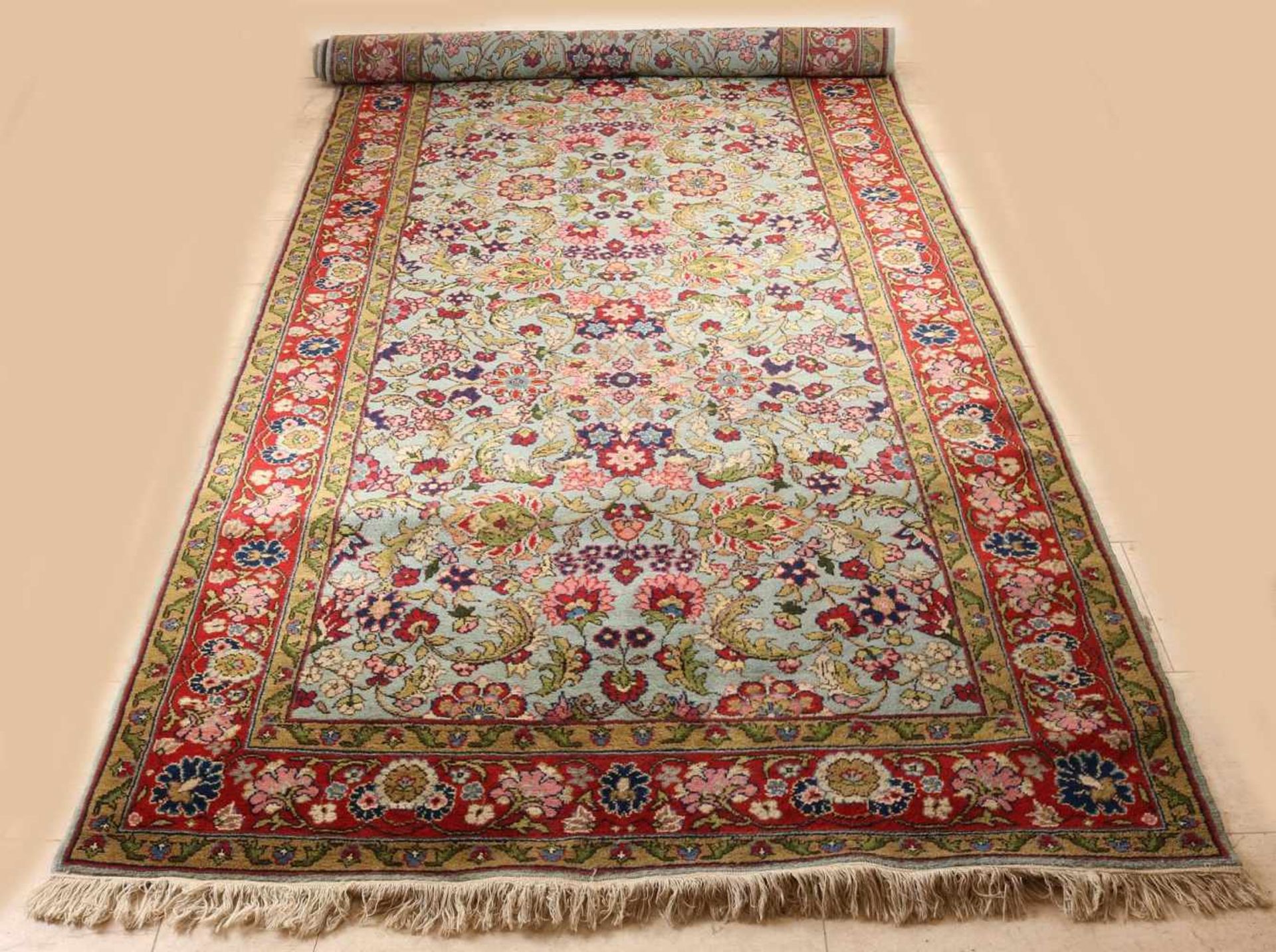 Persian rug entirely with floral decoration in red / green / cream etc. Size: 157 x 396 cm. In