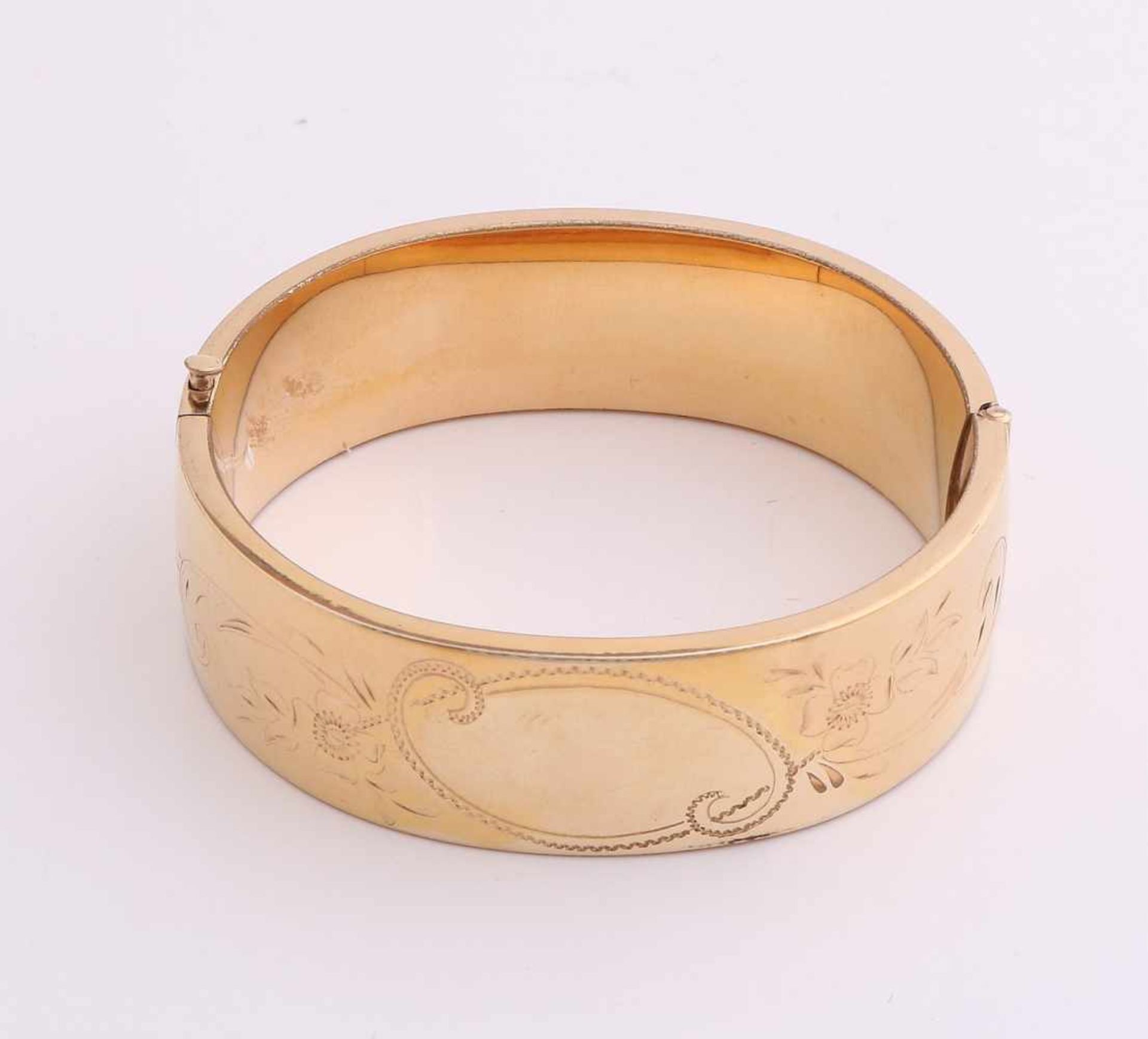 Heavy goldplated slaves band, wide model, 19mm, on the upper side provided with carvings. Equipped