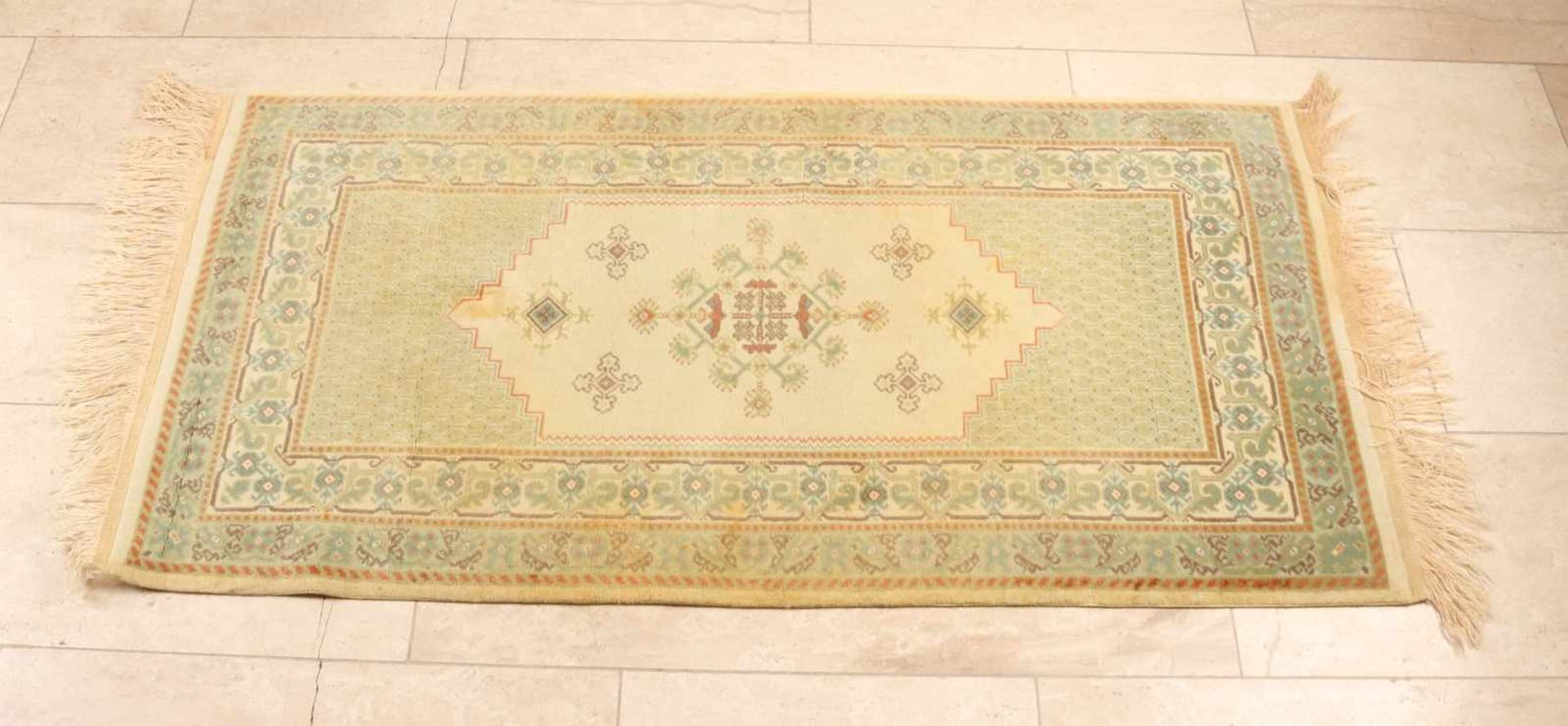 Persian rug. Cream-green. Size: 138 x 74 cm. In good condition.