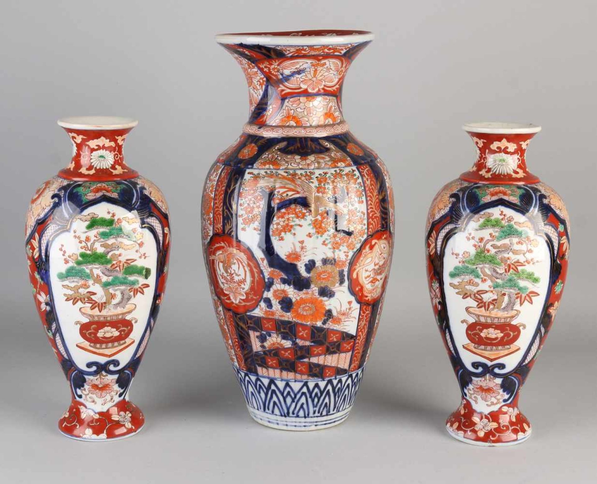 Three large 19th century Imari porcelain vases with garden / gold decor. One set of vases, one