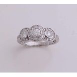 Beautiful gold ring, 750/000, with diamond. Ring 3-tight rosettes set with brilliant-cut diamonds,