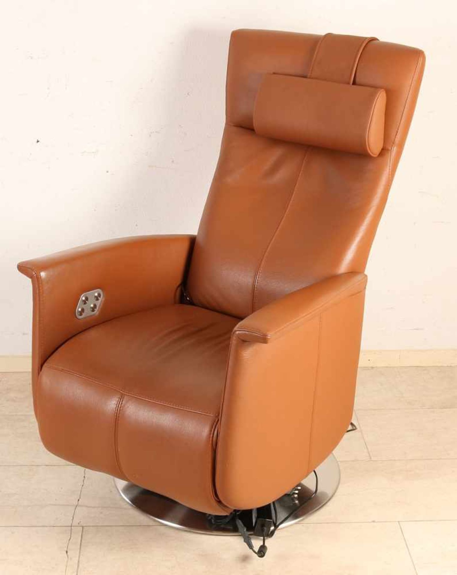 Brown leather rebel-chair with electrical operation. Equipped with heavy aluminum foot. Second