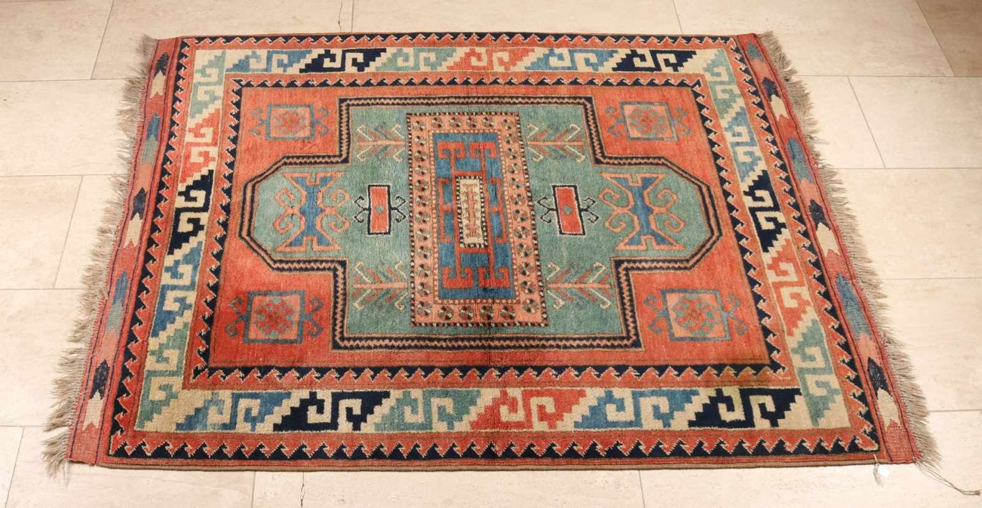 Old Persian rug in the color salmon / blue / black / cream. Size: 150 x 113 cm. In good condition.