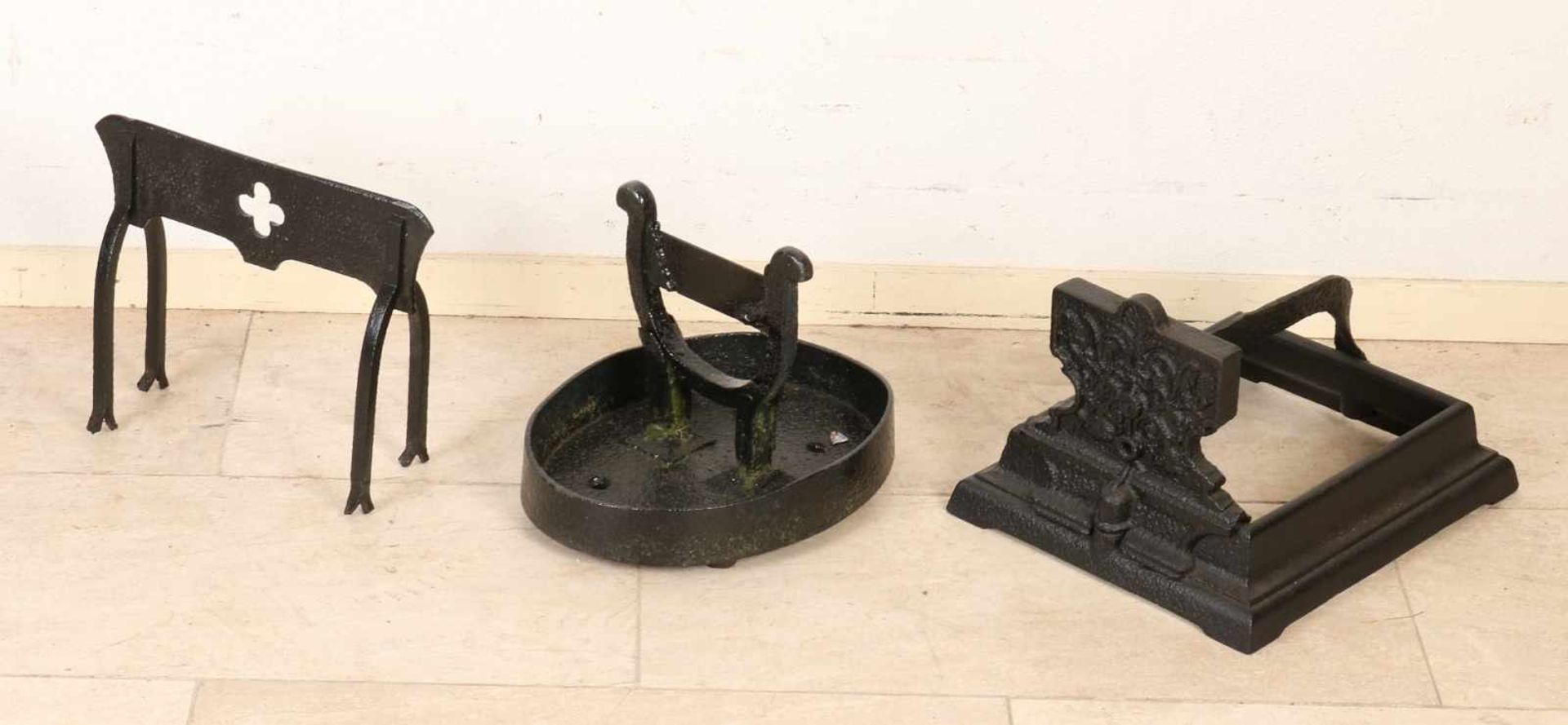 Three antique cast iron boots-scrapers. 19th century. Size: 25-36 cm. In good condition.