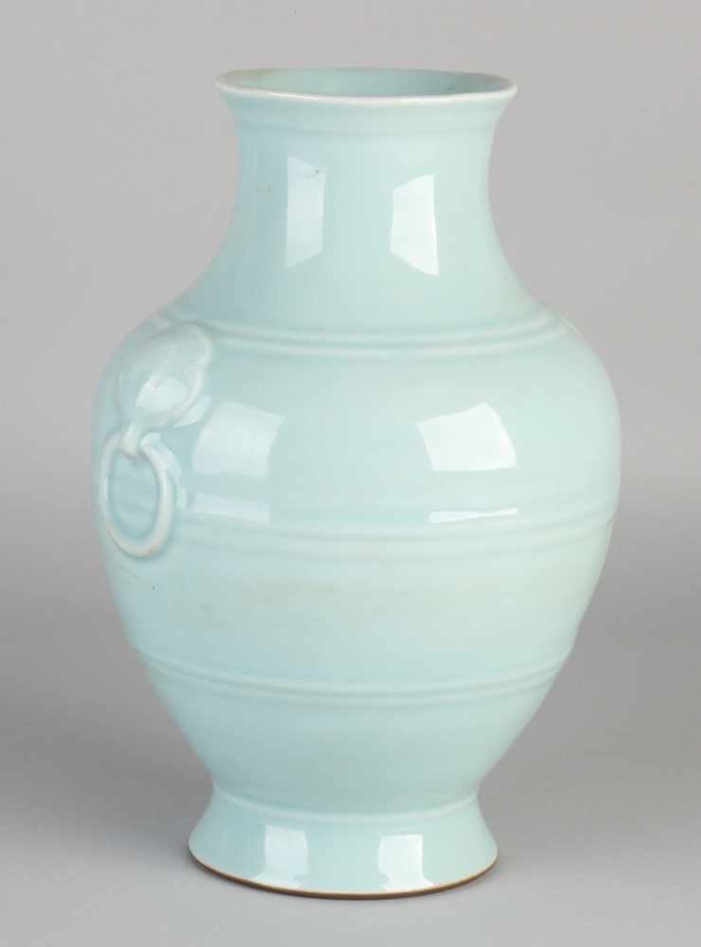 Light blue glazed Chinese porcelain vase with bottom mark and reprocessed rings. Dimensions: H 26