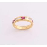 Yellow gold ring, 750/000, with diamond and ruby. Solid spherical ring with a channel setting set