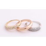 Gold rings, a white gold and yellow gold ring, 750/000, set with diamonds and a rose gold ring,