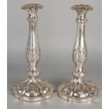 Set silver candlesticks 812/000, on molded round base decorated with floral decor. ø15x29cm. Vienna,