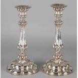 Two silver table candlesticks 800/000, on a round scalloped base with lobed operation over the