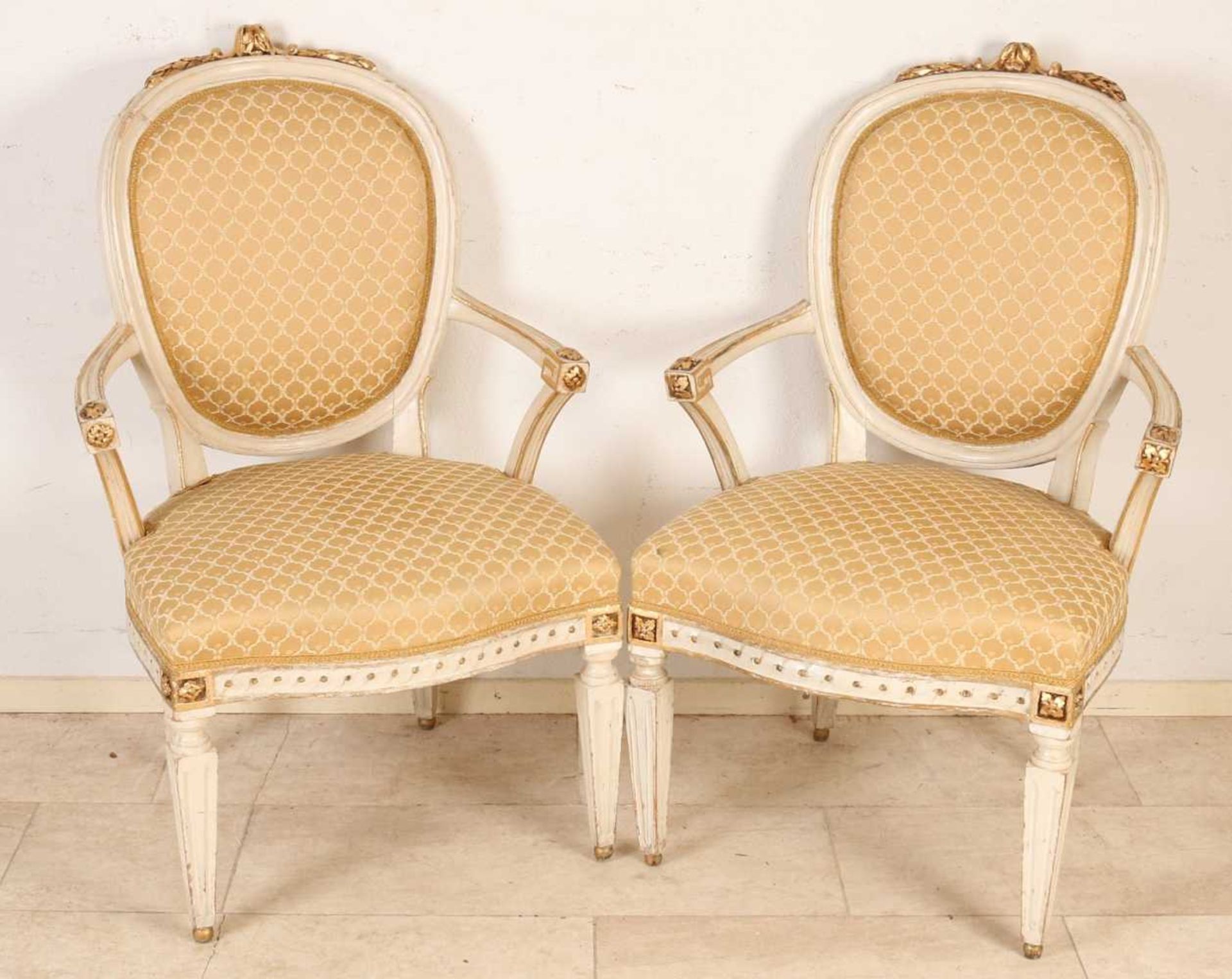 Two 19th century Louis XVI style armchairs with original polychrome and gold leaf. With good