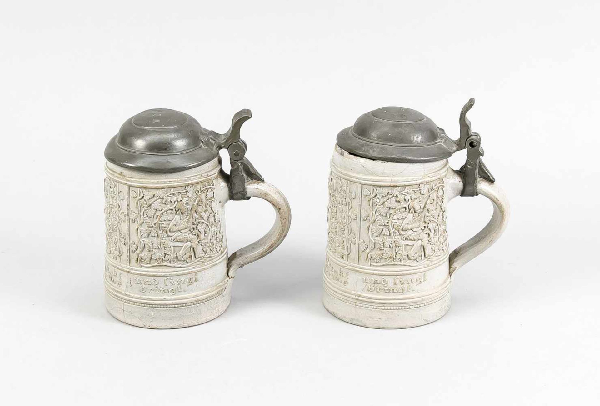 Two 18th - 19th century gray stoneware drinking jugs with texts and vines decor. Chips +