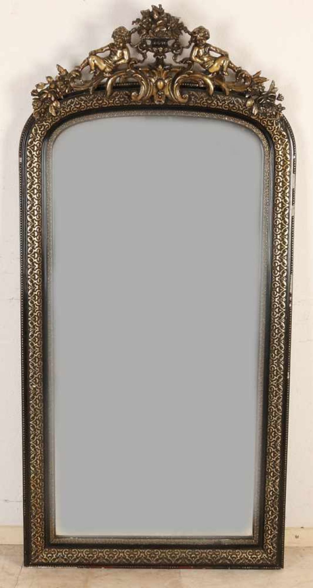Large gold-plated 19th century Louis Philippe mirror with putti and faceted mirror. Approximately
