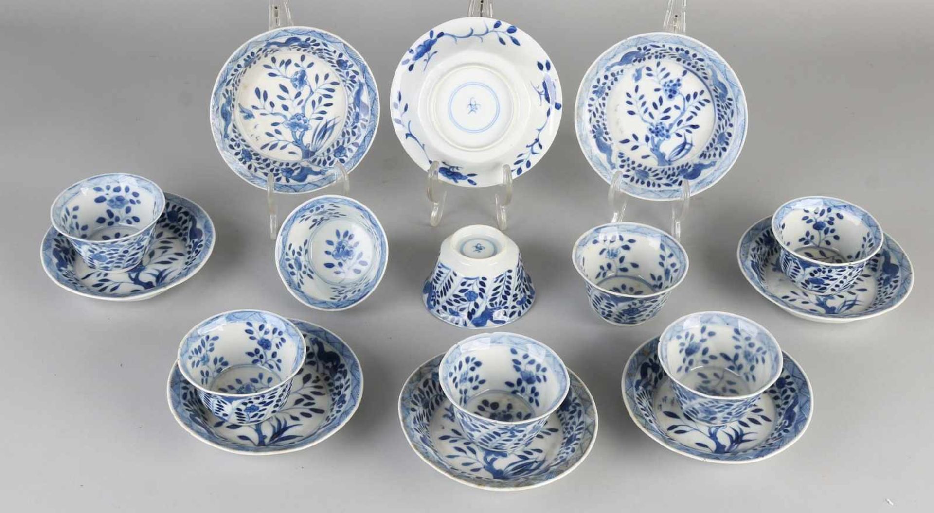 Eight Chinese porcelain Kangxi branded cups and saucers with chicken / parsley decor. Five dishes