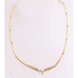 Ornate golden choker, 750/000, with diamond. Choker with stick shift bits with white gold