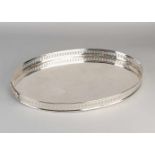 Large silver tray, oval model with a fine serrated edge with circular pattern. 47x34x3cm. total