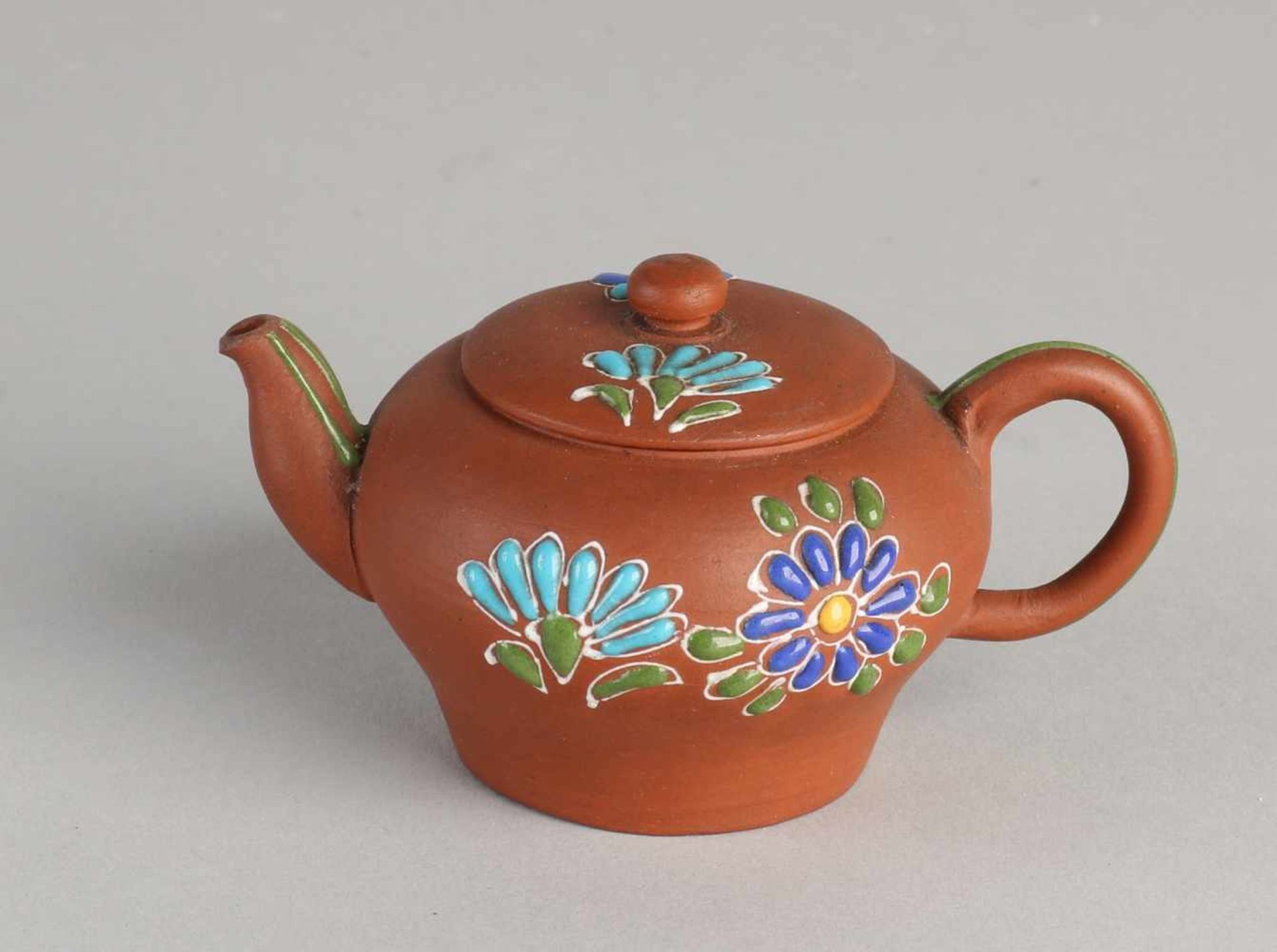 Small Chinese Yixing teapot with floral enamel decoration. Without bottom mark. Size: 4.5 x 9 x 5.