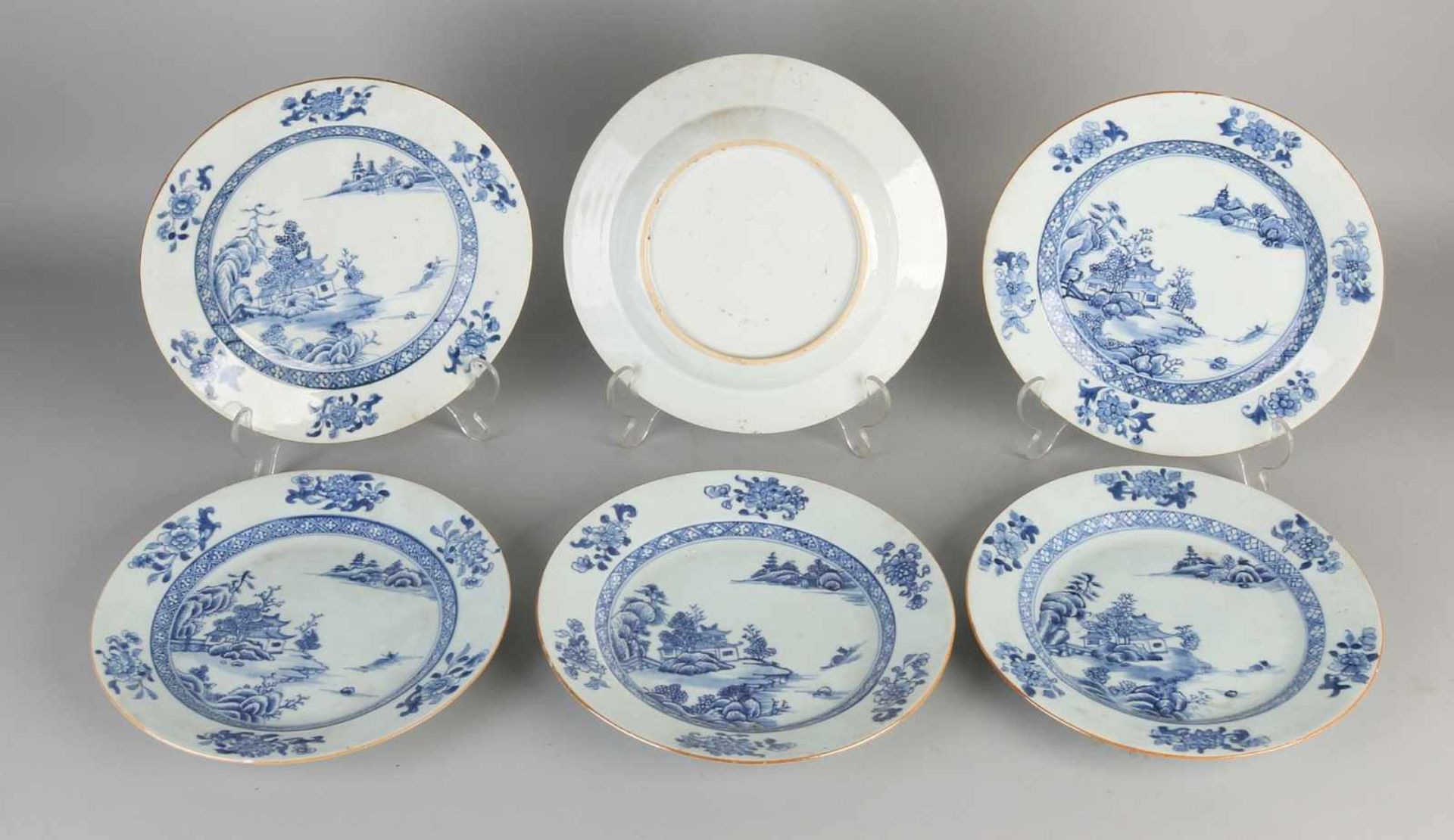 Six 18th century Chinese porcelain plates with pagodas in landscape decor. A chip, a hairline. Size: