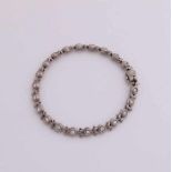 Beautiful white gold bracelet, 750/000, with diamond. A bracelet with harp-shaped links, connected