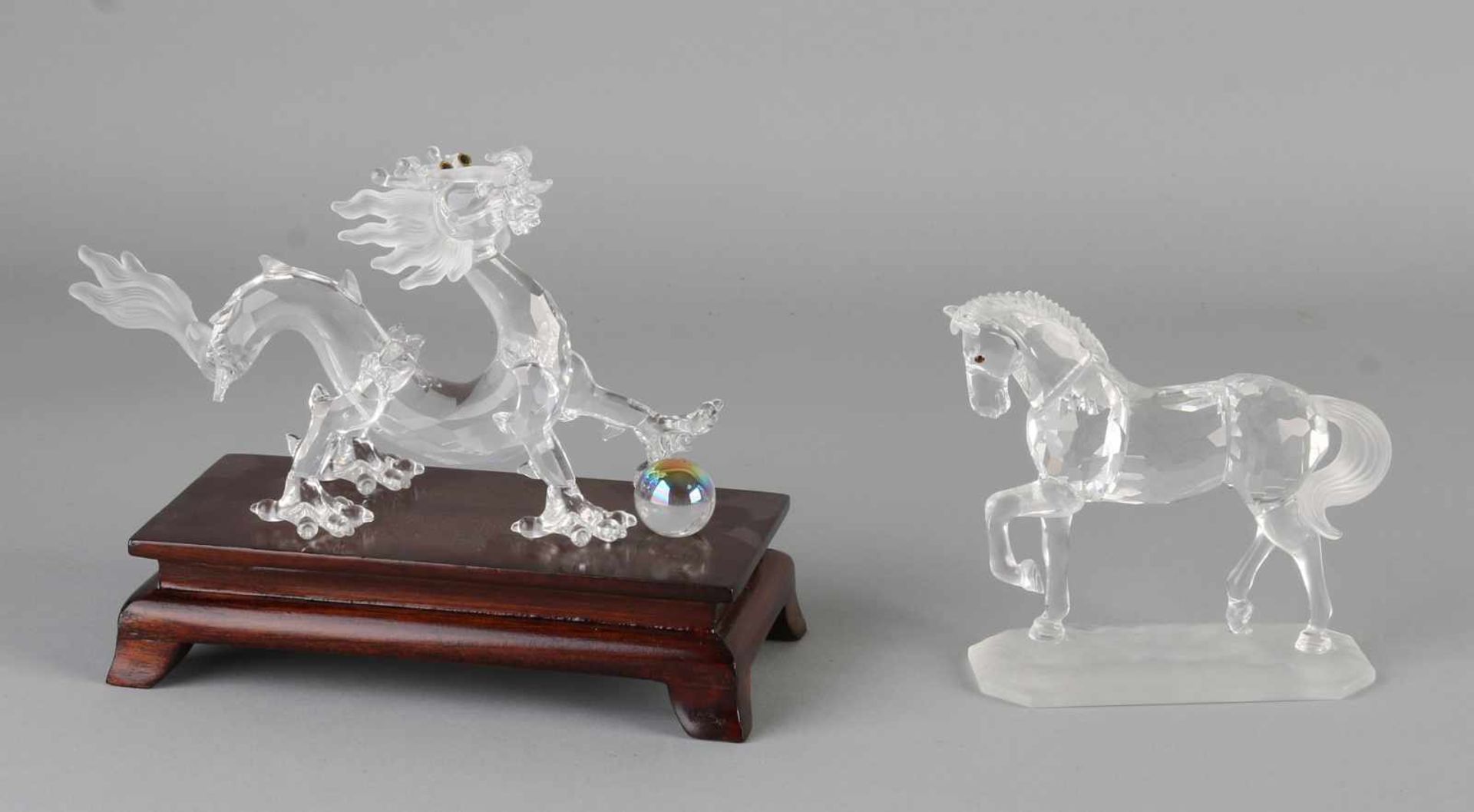 Two parts Swarovski in good condition with original boxes: 1x dragon with display (238202 Crystal