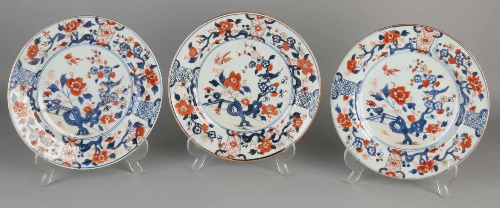 Three parts of 18th century Chinese porcelain. Family Rose signs with garden decor. Size: ø 23 cm.