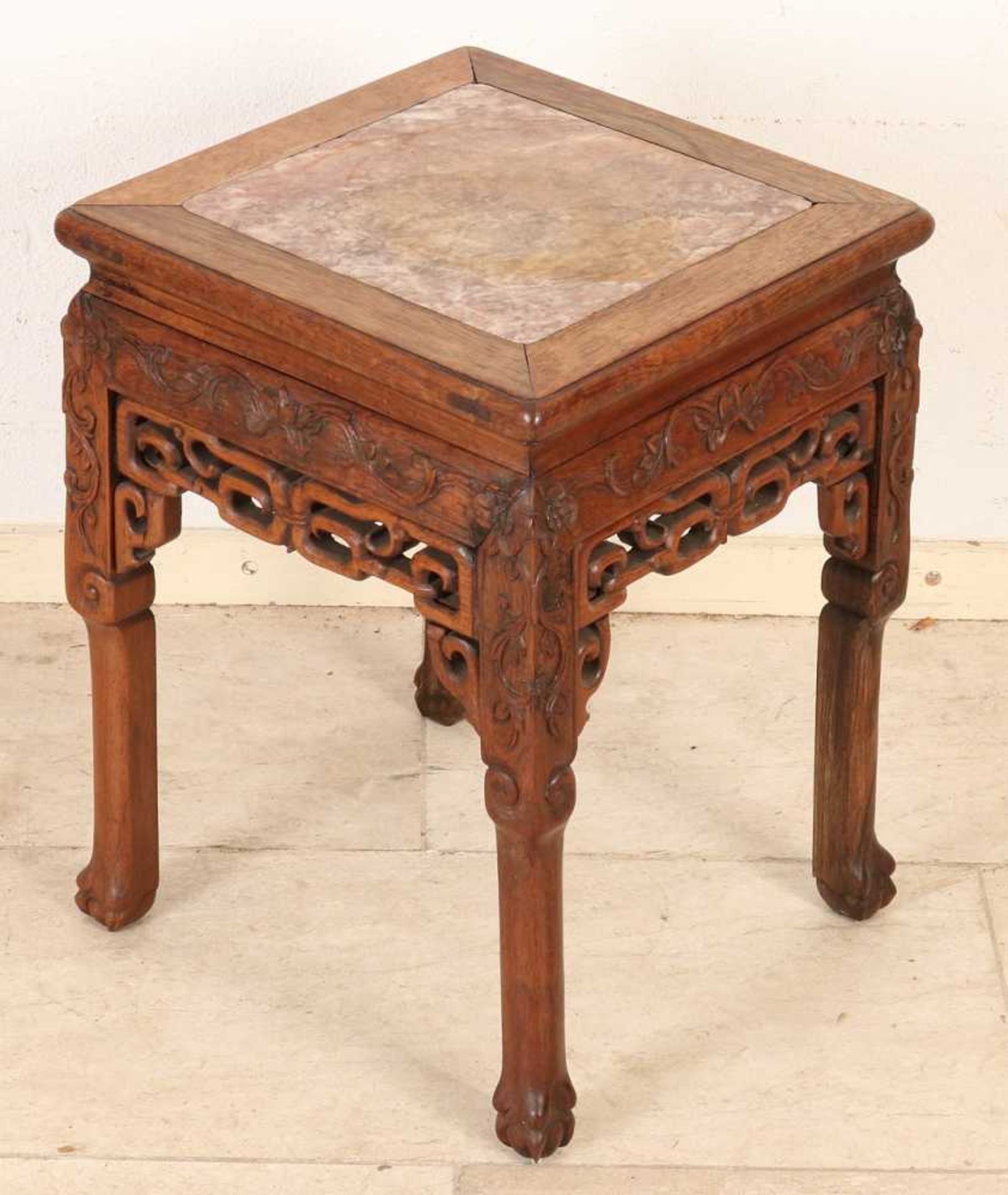 Antique Chinese wood put footstool with floral decor and marble top. Size: 48 x 36 x 36 cm. In