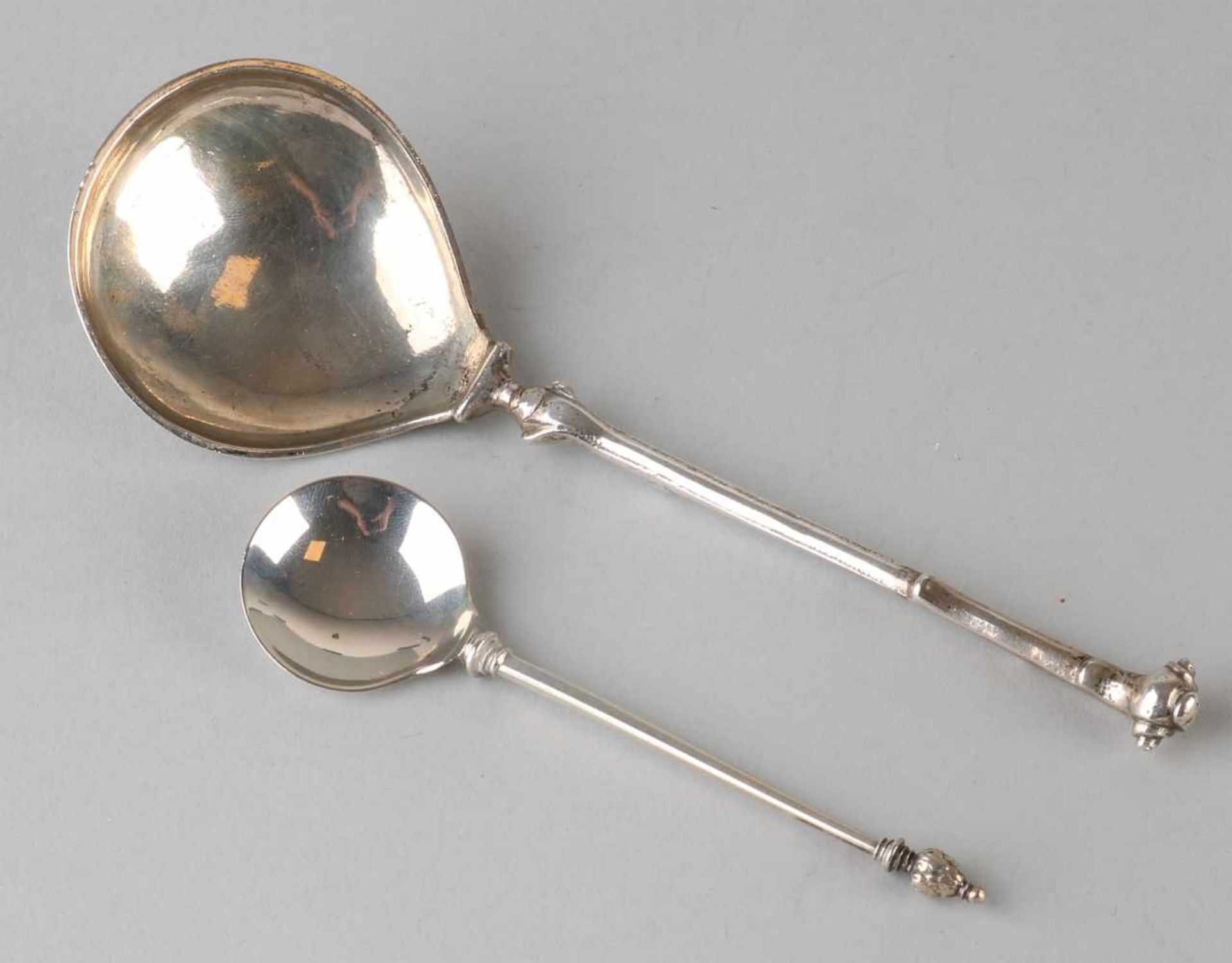 Two silver spoons, 833/000, one 18th century with round silver spoon bowl and a stem with a
