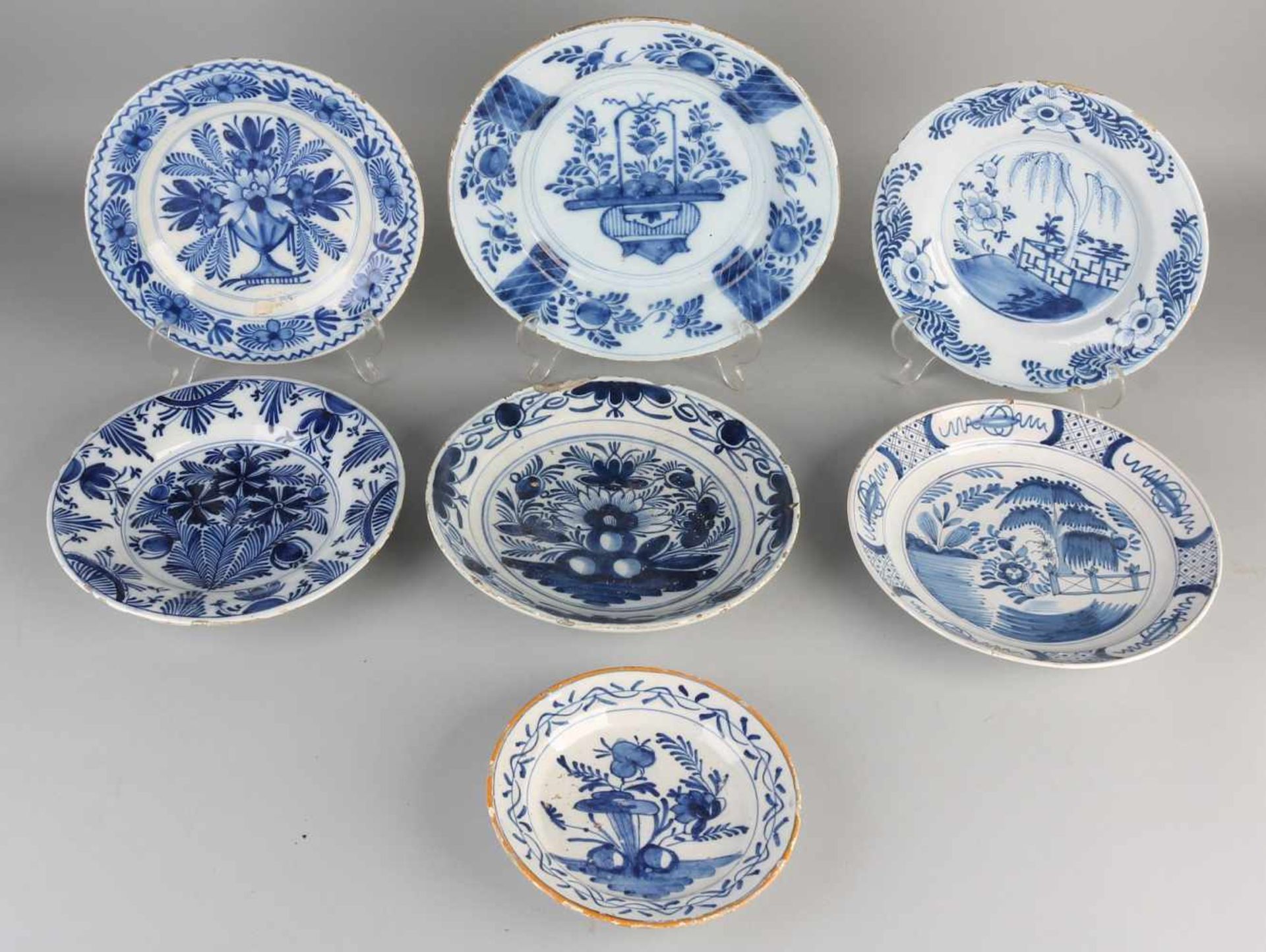 Seven various antique Delft Fayence signs. 18th century. Some edge damage. Size: ø 17-26 cm. In good