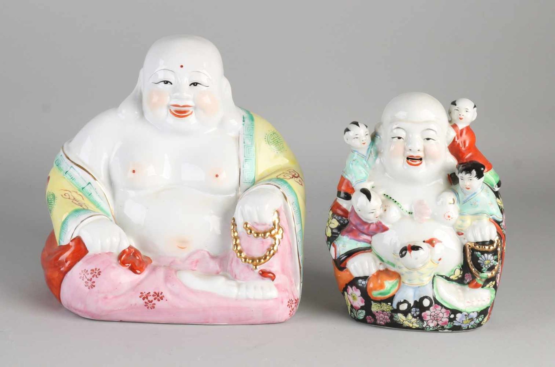 Two Chinese porcelain smiling Buddhas. 20th century. Size: H 17-20 cm. In good condition.