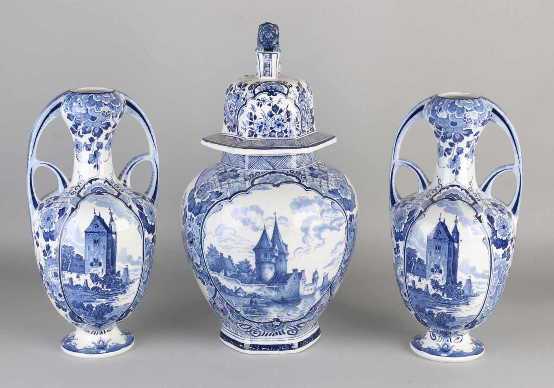 3-Piece Delft Nouveau ceramics cabinet set with scenery backdrops. Circa 1915. One Vase hairline.